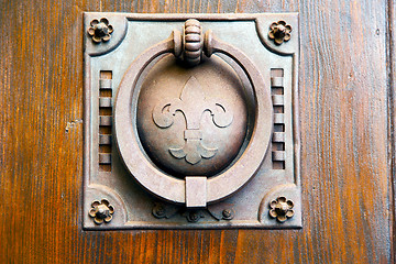Image showing   knocker in a  door curch  closed wood italy   cross