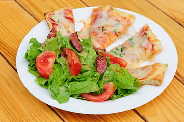 Image showing Pizza slices and salad