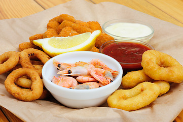 Image showing beer snack, shrimps, calmar rings and fish sticks