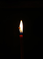 Image showing Burning candle in the dark