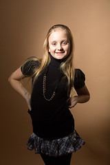 Image showing Fashion smiley european little girl posing