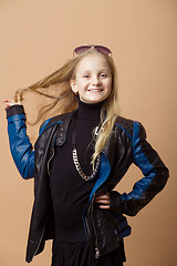 Image showing Fashion smiley european little girl posing