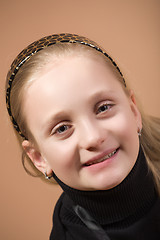 Image showing Fashion smiley european little girl posing