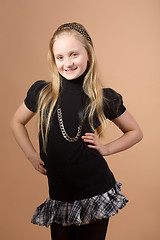 Image showing Fashion smiley european little girl posing