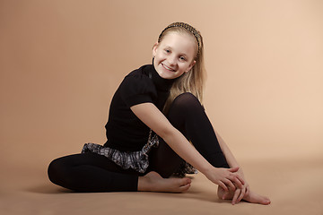 Image showing Fashion smiley european little girl posing