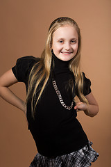 Image showing Fashion smiley european little girl posing