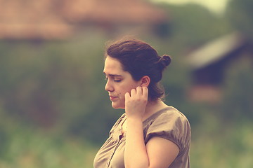 Image showing pensive woman outdoor portrait