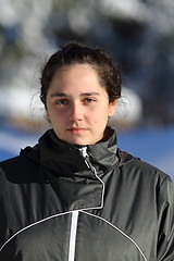 Image showing portrait of young woman on winter background