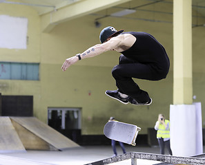 Image showing Young skateboarders training in skatepark