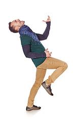 Image showing Young man playing air guitar