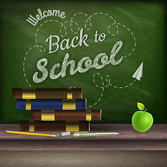 Image showing School books and apple against blackboard. EPS 10