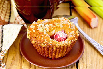 Image showing Cupcake rhubarb on plate with cup and napkin