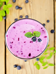 Image showing Milkshake with blueberries on board top