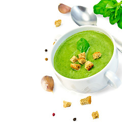 Image showing Soup puree with croutons and spoon in bowl