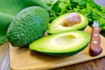 Image showing Avocado with parsley on board