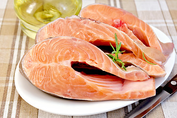 Image showing Trout in plate with rosemary and oil on napkin