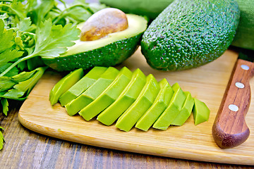 Image showing Avocado slices on board