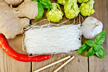 Image showing Noodles rice thin with broccoli and spices on board