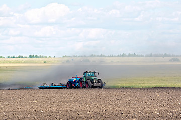 Image showing Tractor working on arable land