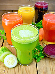 Image showing Juice cucumber and vegetable in glassful on board