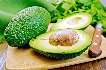 Image showing Avocado with napkin on board