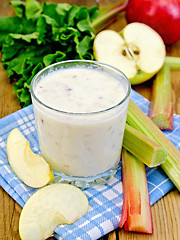 Image showing Milkshake with rhubarb and apples on napkin