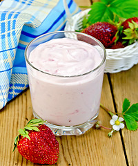 Image showing Milkshake with strawberry on board