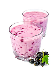 Image showing Milkshake with black currants in two glassful