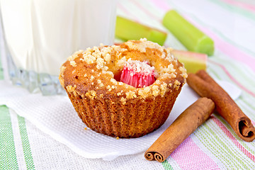 Image showing Cupcake with rhubarb and milk on linen napkin