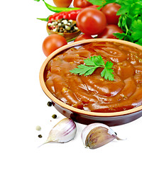 Image showing Ketchup in pottery with vegetables and spices