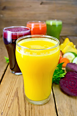 Image showing Juice pumpkin and vegetable in glassful on board