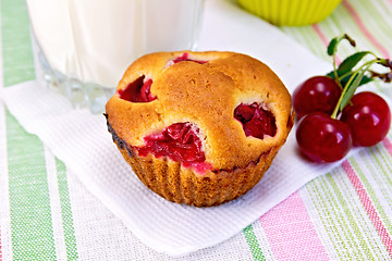 Image showing Cupcake with cherries and milk on linen napkin