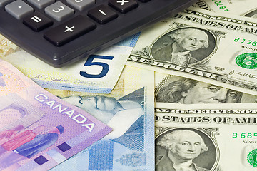 Image showing Forex - US and Canadian currency pair with calculator

