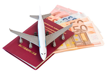 Image showing Passport with toy plane and money