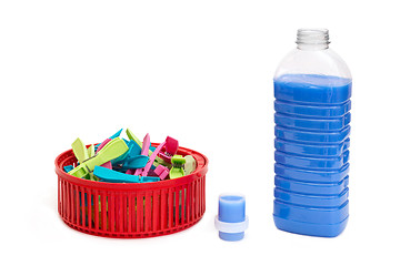 Image showing Laundry detergent and clothespins