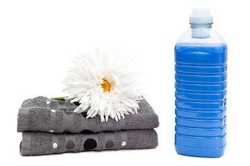 Image showing Laundry detergent with towels and flower