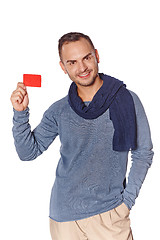 Image showing Smiling casual man showing blank credit card