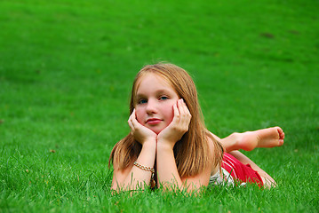Image showing Young girl grass