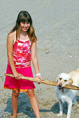 Image showing Girl play dog