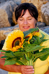 Image showing Mature woman flowers