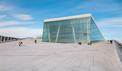 Image showing People walking on the roof of the Oslo Opera House. The Oslo Opera House is home The Norwegian National Opera and Ballet, and the National Opera Theatre.