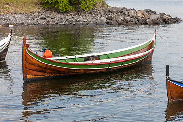 Image showing Small boat on clear water 