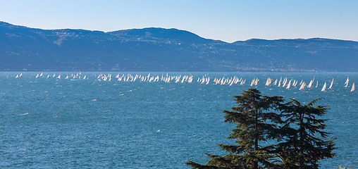 Image showing Sail boat on a lake with mountains as background