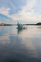 Image showing OSLO - May 4, 2011.  \'She Lies\' is the name of a floating glass and steel construction that turns with the wind and tide, created by Monica Bonvicini; May 4, 2011 near the Opera House, Oslo, Norway.