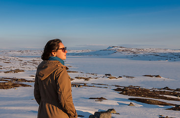 Image showing The girl on the background of snow-covered plains