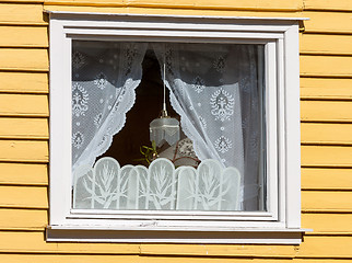 Image showing window in a wooden house with white curtains