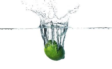 Image showing Fresh lime falling into water