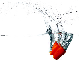 Image showing Pepper drops into a water 