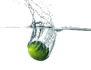 Image showing Fresh lime falling into water