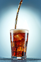 Image showing Cola pouring in a glass